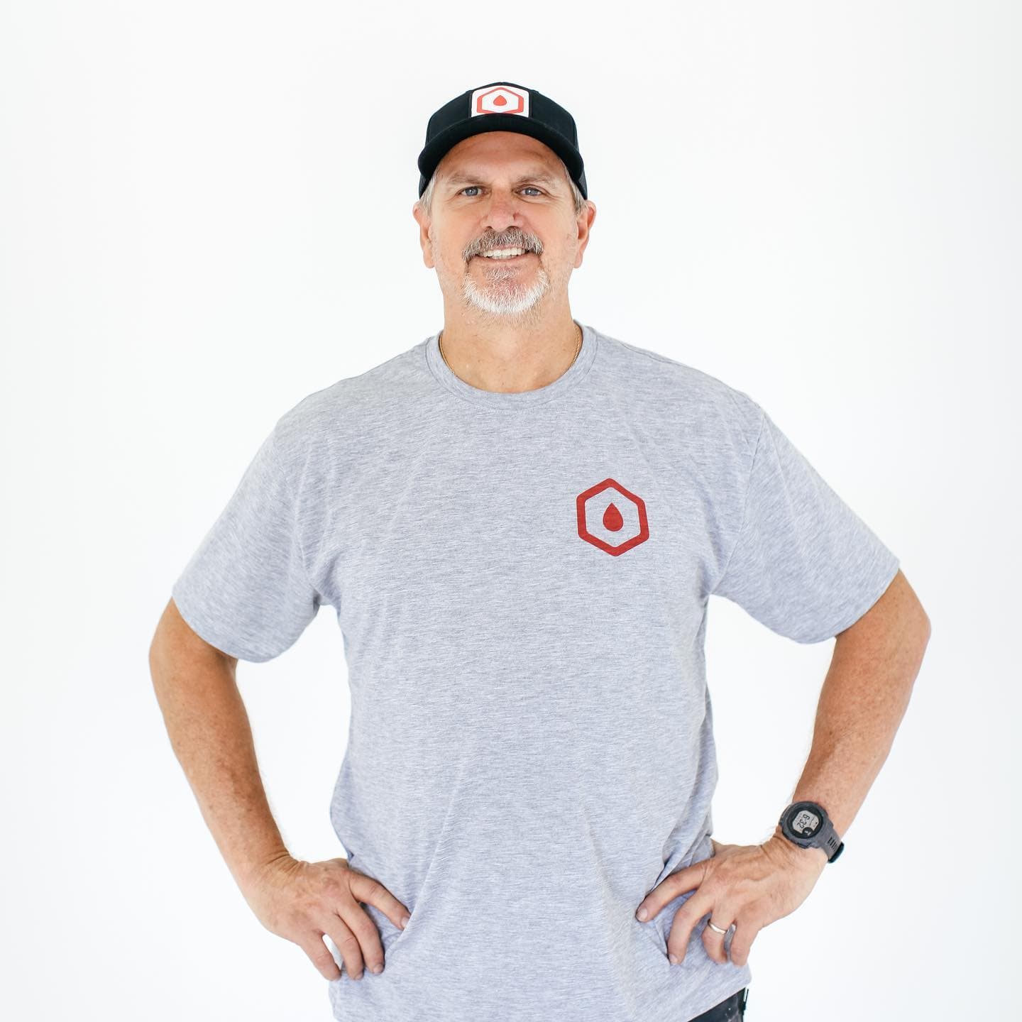 Jay Hanlon, owner of Filter Tech Inc., smiling in a Filter Tech t-shirt and cap